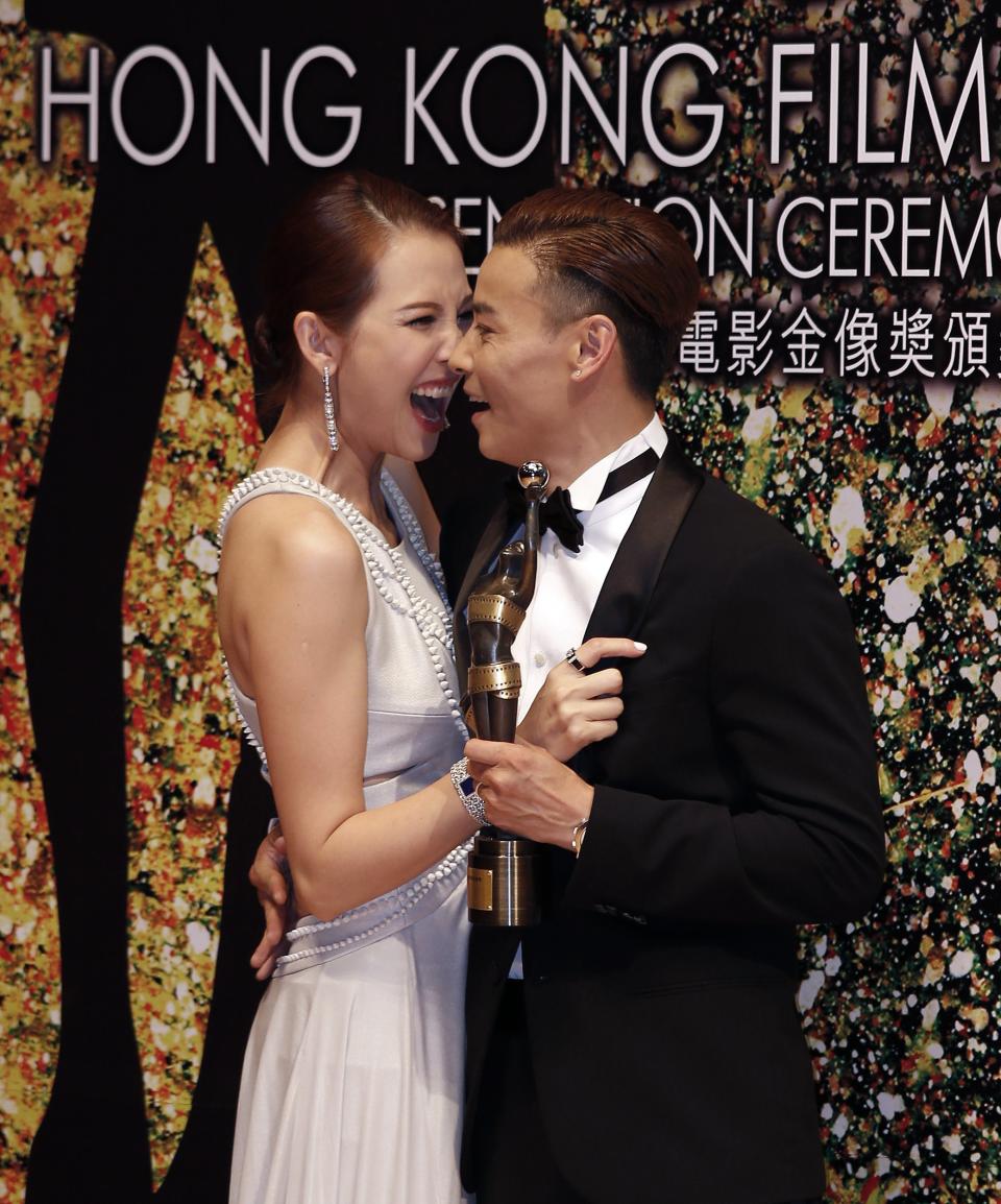 Chinese actor Zhang and wife Ada react backstage at the 33rd Hong Kong Film Awards in Hong Kong