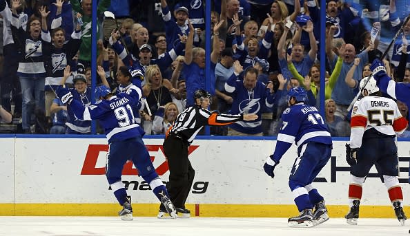 TAMPA, FL - OCTOBER 18: Referee Gord Dwyer #19 signals a goal as Steven Stamkos #91 and Alex Killorn #17 of the Tampa Bay Lightning celebrate as Jason Demers #55 of the Florida Panthers reacts during the third period at the Amalie Arena on October 18, 2016 in Tampa, Florida. (Photo by Mike Carlson/Getty Images)