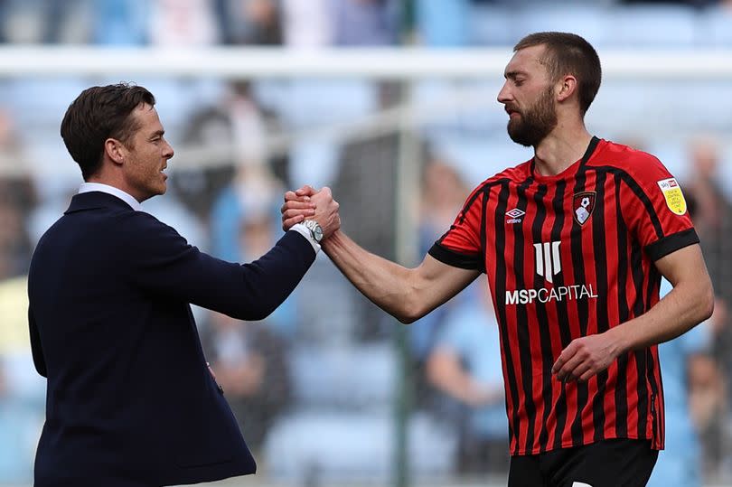 COVENTRY, ENGLAND - APRIL 18: Scott Parker the manager / head coach of Bournemouth and Nathaniel Phillips of Bournemouth at full time of the Sky Bet Championship match between Coventry City and AFC Bournemouth at The Coventry Building Society Arena on April 18, 2022 in Coventry, England.