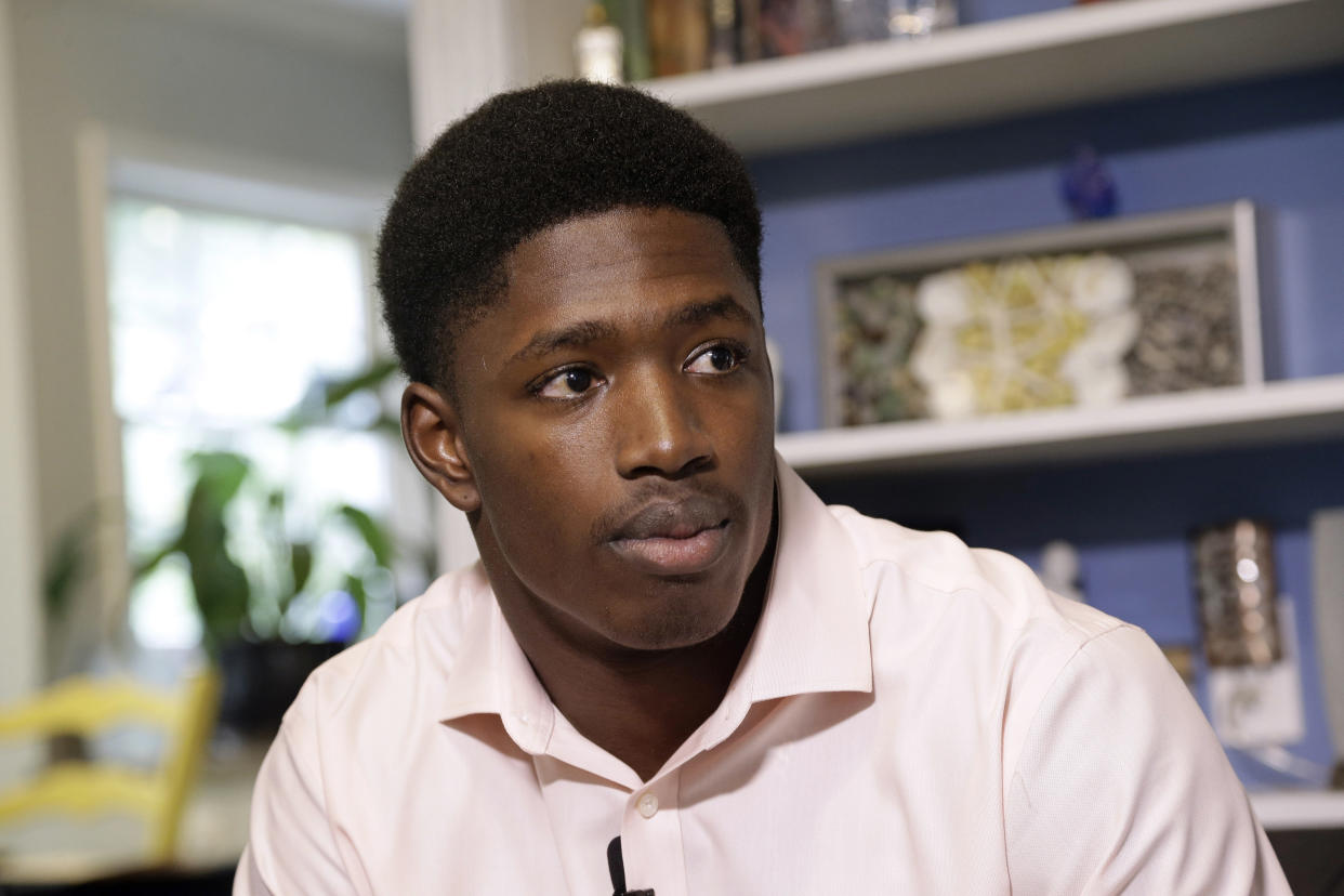 Allen Artis takes questions from members of the media Tuesday, Sept. 27, 2016 in Durham, N.C. Artis, a North Carolina football player facing charges of sexual battery and assault on a female student says the two had consensual sex and that he did not rape nor drug her. (AP Photo/Gerry Broome)