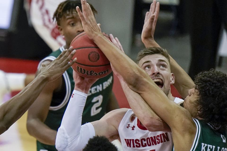Wisconsin's Trevor Anderson tries to shoot during the second half of an NCAA college basketball game against Wisconsin-Green Bay Tuesday, Dec. 1, 2020, in Madison, Wis. (AP Photo/Morry Gash)