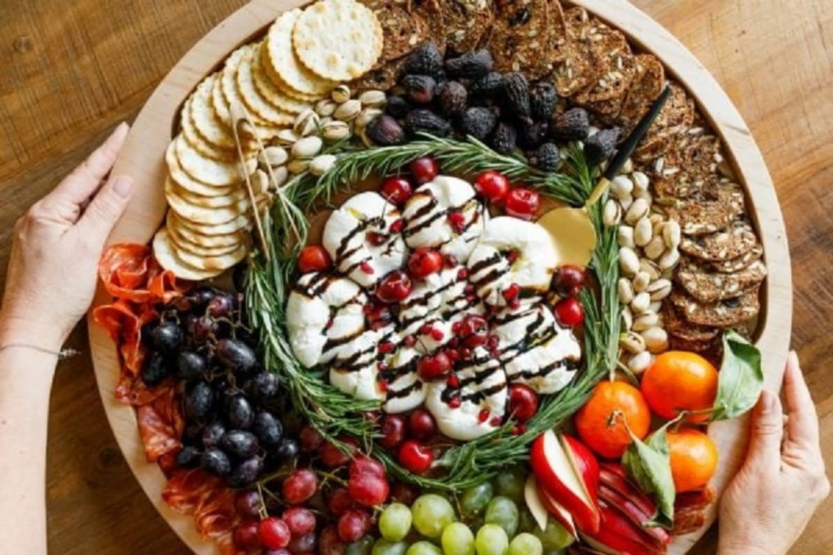 <p>Reluctant Entertainer</p><p>The ultimate winter burrata charcuterie board has burrata (young mozzarella), salami, nuts and winter fruits like grapes, pears and figs!</p><p><strong>Get the recipe: </strong><a href="https://reluctantentertainer.com/winter-burrata-charcuterie-board/" rel="nofollow noopener" target="_blank" data-ylk="slk:Winter Burrata Charcuterie Board;elm:context_link;itc:0;sec:content-canvas" class="link rapid-noclick-resp"><strong>Winter Burrata Charcuterie Board</strong></a></p>