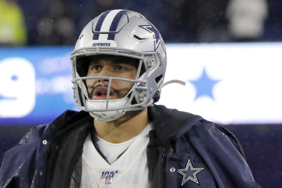 Dallas Cowboys quarterback Dak Prescott watches from the sideline during the final minute of an NFL football game against the New England Patriots, Sunday, Nov. 24, 2019, in Foxborough, Mass. (AP Photo/Bill Sikes)