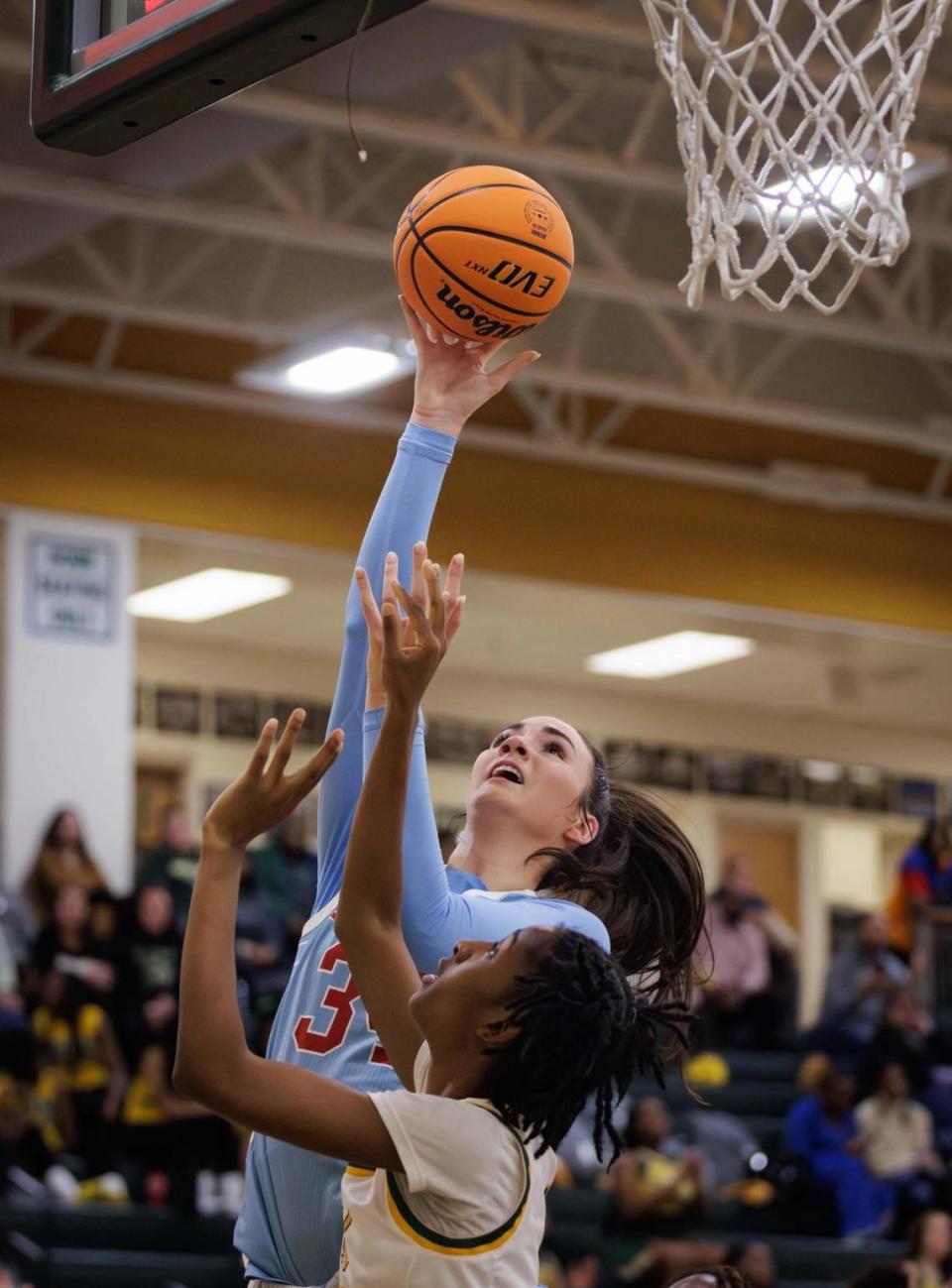 Cougar’s Blanca Thomas (34) drives the lane for the layup. Top ranked Independence Girls Basketball team would host the 2nd ranked Charlotte Catholic Cougars December 12, 2023.