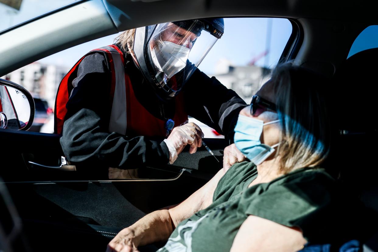 Health registered nurse Karen Nerger administers a dose of the Pfizer-BioNTech vaccine at a mass COVID-19 vaccination event on 30 January, 2021 in Denver, Colorado. Half of unvaccinated adults definitely do not want to get the jab, a new poll has found. (Getty Images)