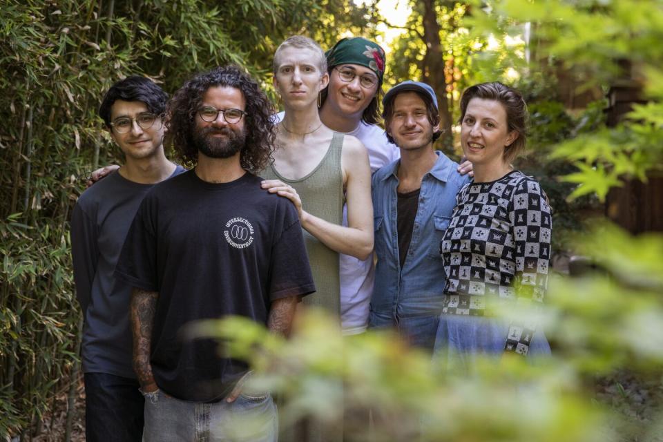 A group of people in a parklike setting