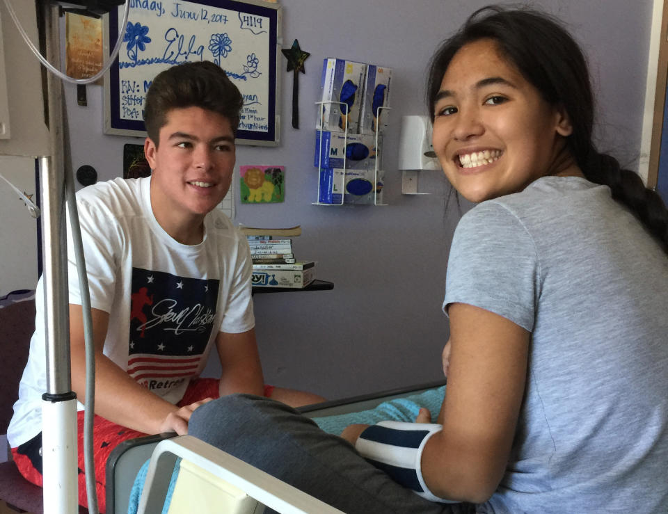 Hank and Ella Bachmeier sit together in a San Diego-area hospital, a stay that lasted two months for Ella. (Courtesy of the Bachmeier family)