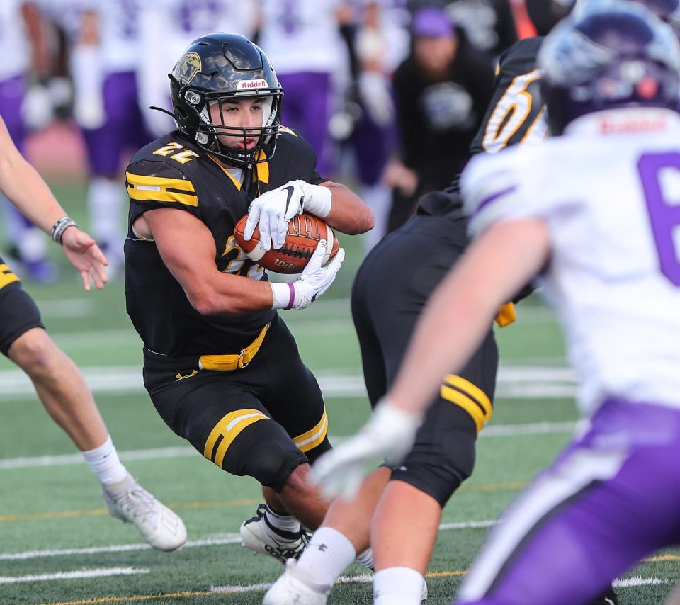 Running back Peter MacCudden (22), who has rushed for nearly 1,000 yards in two seasons at UW-Oshkosh, is one of the top returning offensive players for the Titans this season.