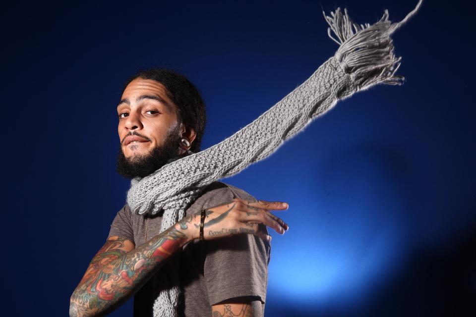 FILE - In this Dec. 8, 2011 file photo, Gym Class Heros frontman Travie McCoy poses for a portrait in New York. Though Gym Class Heroes had a hit with the song "Stereo Hearts," the band's fourth album “The Papercut Chronicles II” debuted at No. 54 on Billboard’s Top 200 albums chart, spending one week on the list. (AP Photo/Carlo Allegri, file)