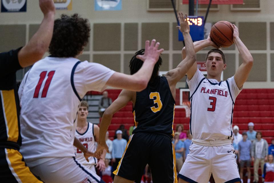 Plainfield Quakers junior Chris Arvanitis looks to pass to senior Collin Schmidt Jan 5, 2024, at Plainfield High School in Plainfield, Indiana.