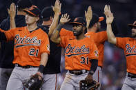 Baltimore Orioles left fielder Austin Hays (21) and center fielder Cedric Mullins (31) celebrate with teammates after a baseball game against the Detroit Tigers, Saturday, July 31, 2021, in Detroit. (AP Photo/Carlos Osorio)