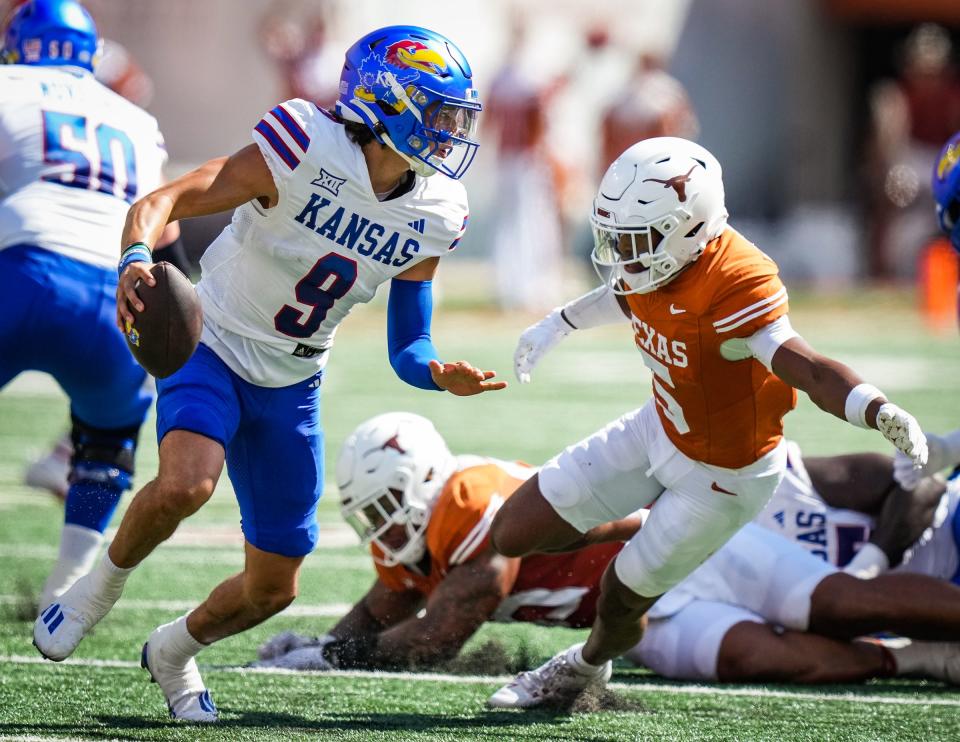 Texas defensive back Malik Muhammad tries to tackle Kansas quarterback Jason Bean in Texas' win Sept. 30 at Royal-Memorial Stadium. Muhammad, a freshman from Dallas, has made an immediate impact on the secondary.