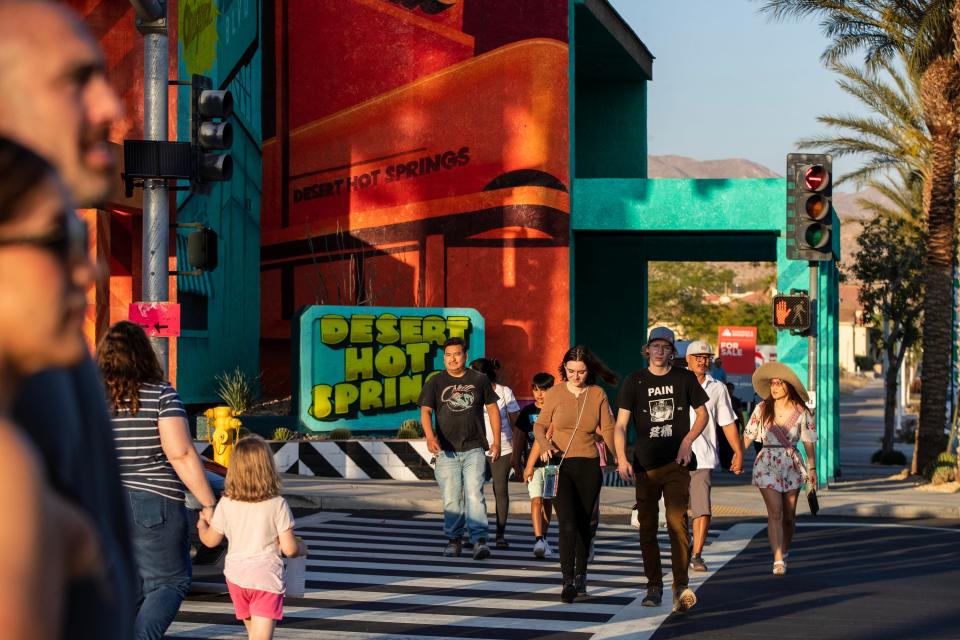 People gather on Palm Drive and Pierson Boulevard for the first of five consecutive, Friday Nights on Pierson, in downtown Desert Hot Springs, Calif., on Fri., May 12, 2023.  