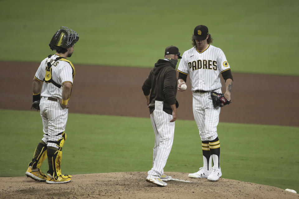 San Diego Padres starting pitcher Chris Paddack is taken out of the game by manager Jayce Tingler after giving up two solo home runs to the Arizona Diamondbacks in the sixth inning of a baseball game Saturday, Aug. 8, 2020, in San Diego. (AP Photo/Derrick Tuskan)