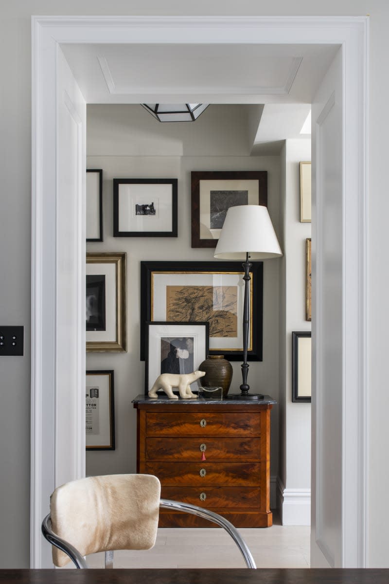 hallway area with gallery wall and vintage drawers