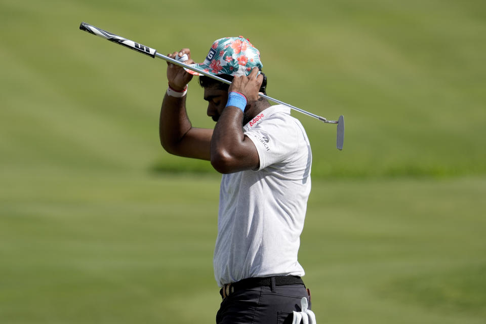 Sahith Theegala reacts after missing his birdie putt on the 18th green during the final round of The Sentry golf event, Sunday, Jan. 7, 2024, at Kapalua Plantation Course in Kapalua, Hawaii. (AP Photo/Matt York)