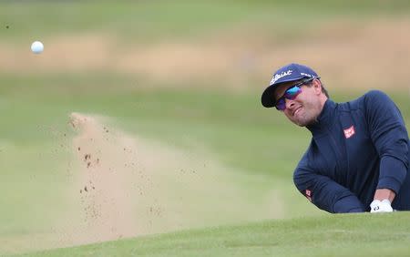 Golf - British Open - Australia's Adam Scott hits out of the bunker on the first hole during the third round - Royal Troon, Scotland, Britain - 16/07/2016. REUTERS/Russell Cheyne