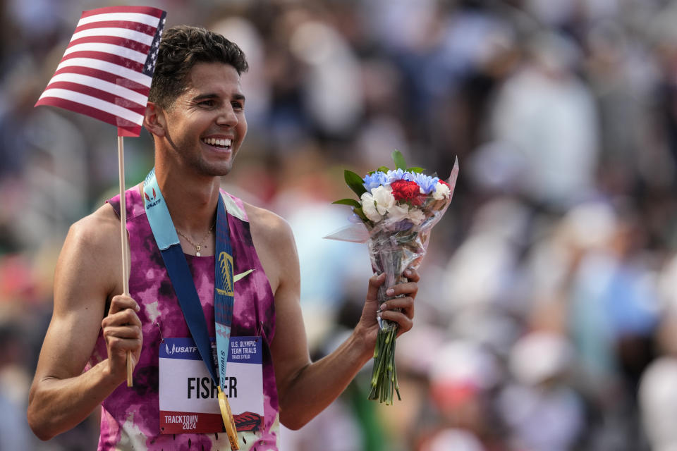 Grant Fisher celebrates winning the men's 5000-meter final run during the U.S. Track and Field Olympic Team Trials, Sunday, June 30, 2024, in Eugene, Ore. (AP Photo/George Walker IV)