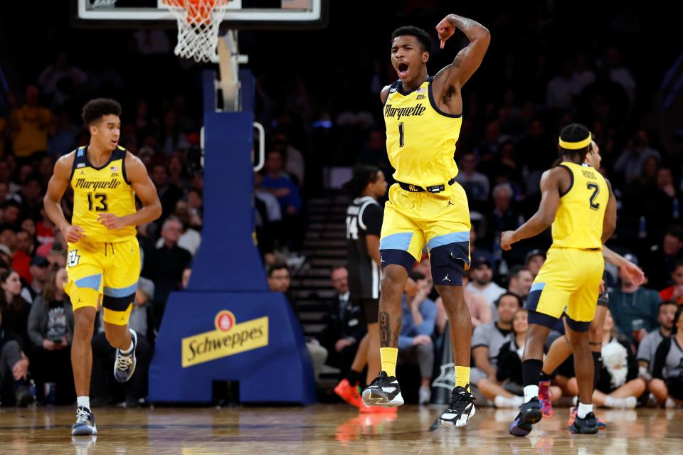 Marquette's Kam Jones (1) reacts against Providence during the Big East Tournament.