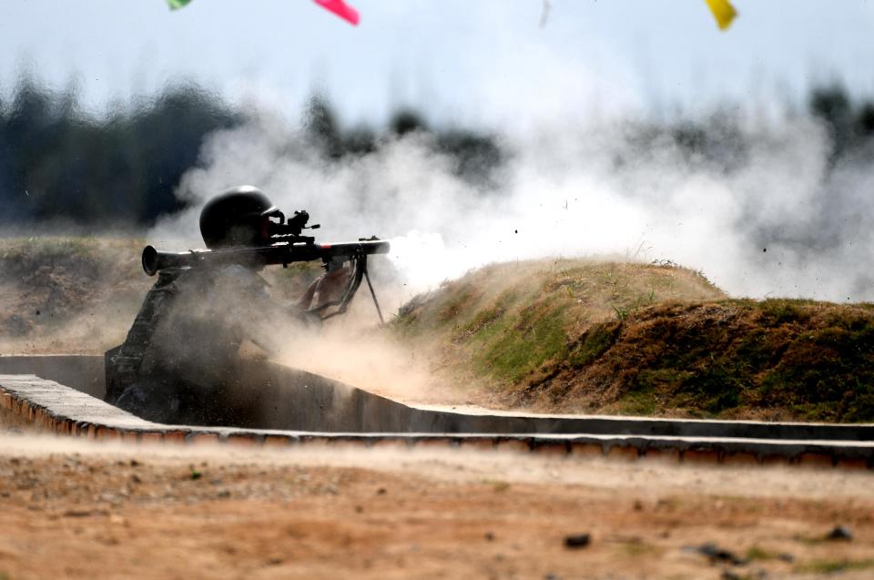 <p>A Chinese team member fires a rocket launcher in the survival trail event of the International Army Games 2018 ‘Seaborne Assault’ on Aug. 2, 2018 in Quanzhou, Fujian Province of China. (Photo: Wang Dongming/China News Service/VCG via Getty Images) </p>