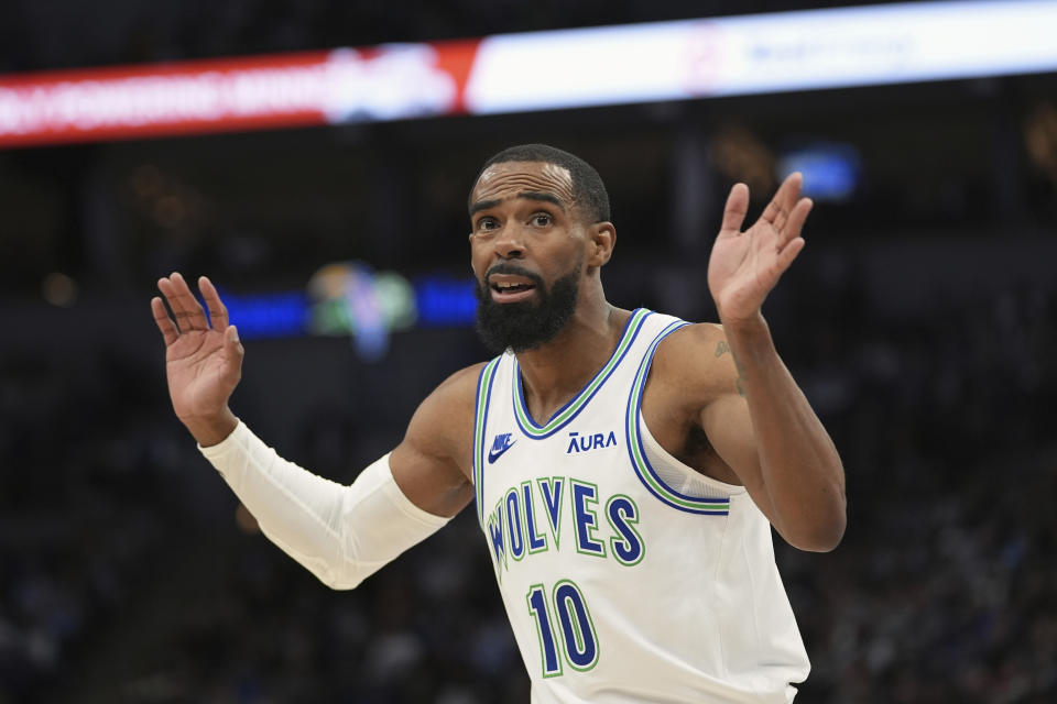 Minnesota Timberwolves guard Mike Conley (10) reacts after being called for a foul during the second half of an NBA basketball game against the Denver Nuggets, Tuesday, March 19, 2024, in Minneapolis. (AP Photo/Abbie Parr)