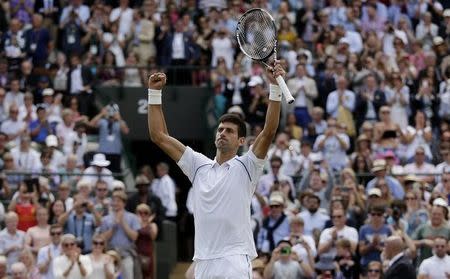 Novak Djokovic of Serbia celebrates after winning his match against Kevin Anderson of South Africa at the Wimbledon Tennis Championships in London, July 7, 2015. REUTERS/Henry Browne