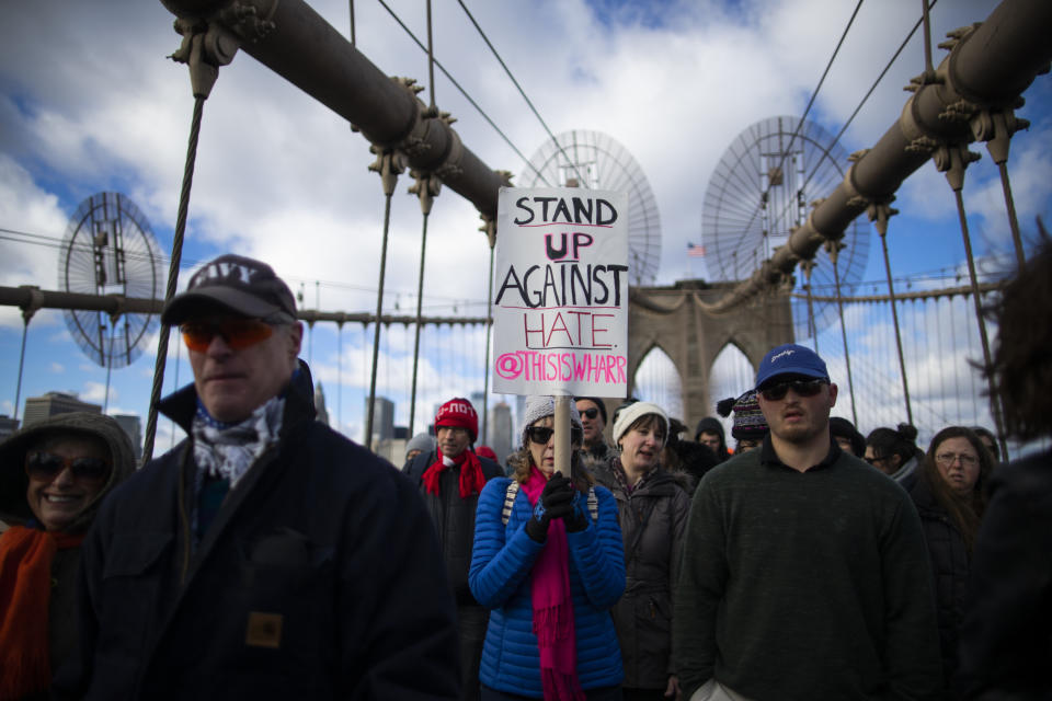 People take part in a march crossing the Brooklyn Bridge in solidarity with the Jewish community after recent string of anti-semitic attacks throughout the greater New York area, on Sunday, Jan. 5, 2020 in New York. (AP Photo/Eduardo Munoz Alvarez)