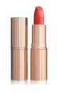 <p>Legendary make-up artist Charlotte Tilbury used ‘Tell Laura’ from her Hot Lips collection – a vibrant matte coral shade inspired by Laura Bailey.<br><a rel="nofollow noopener" href="http://www.charlottetilbury.com/uk/hot-lips-lipstick-tell-laura.html" target="_blank" data-ylk="slk:Buy here;elm:context_link;itc:0;sec:content-canvas" class="link ">Buy here</a> </p>