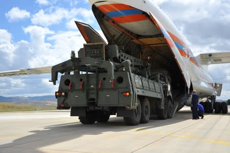 FILE PHOTO: First parts of a Russian S-400 missile defense system are unloaded from a Russian plane at Murted Airport near Ankara