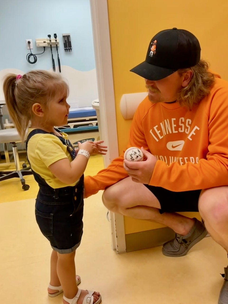 Tennessee pitcher Kirby Connell talks with patient Zoie Bean at East Tennessee Children's Hospital in Knoxville on June 9.