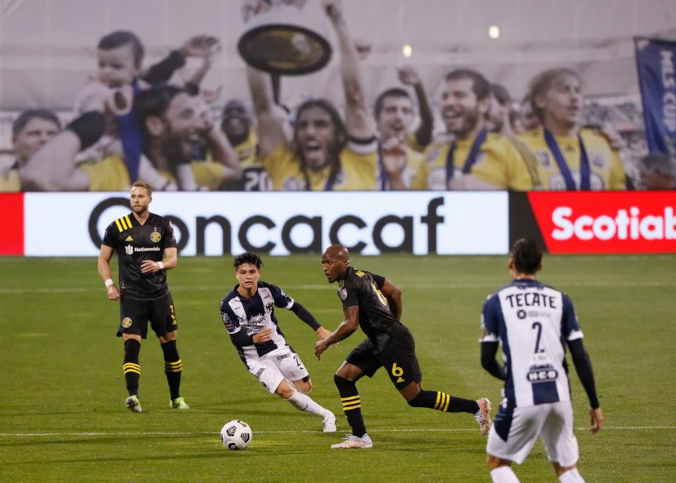 Columbus Crew SC midfielder Darlington Nagbe (6) dribbles around CF Monterrey midfielder Jonathan González (25) in the first half of the first leg of the CONCACAF Champions League quarterfinals at Crew Stadium in Columbus on Wednesday, April 28, 2021. 