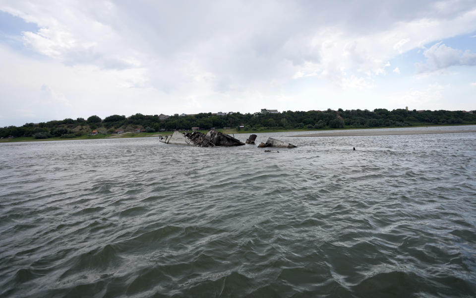 The wreckage of a WWII German warship is seen in the Danube river near Prahovo, Serbia, Monday, Aug. 29, 2022. The worst drought in Europe in decades has not only scorched farmland and hampered river traffic, it also has exposed a part of World War II history that had almost been forgotten. The hulks of dozens of German battleships have emerged from the mighty Danube River as its water levels dropped. (AP Photo/Darko Vojinovic)