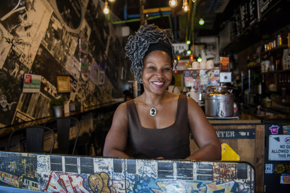 Majora Carter, owner of the Boogie Down Grind, poses for a portrait in the Bronx in New York on Monday, July 24, 2023, in New York. Hip-hop rose from the ashes of a borough ablaze with poverty, urban decay and gang violence. From breaking to graffiti “writing” to MC-ing or rapping, the block parties and various elements of hip-hop served as an outlet for creativity and an escape from the hardships of daily life. Carter, 56, said “I do find it ironic that one of the richest parts of American culture comes from a place that is still one of the poorest parts of our country.” (AP Photo/Brittainy Newman)