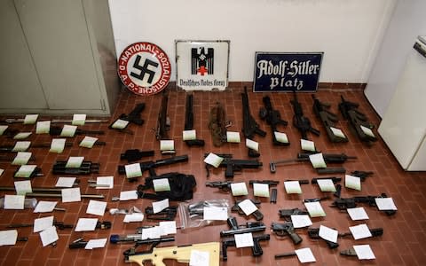 A big cache of guns and ammunition was seized by the Turin special police force - Credit: FRANCESCO AMMENDOLA,HO/AFP/Getty Images