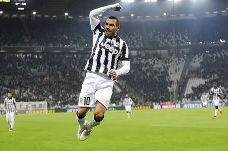 Juventus' Carlos Tevez celebrates after scoring against Hellas Verona during their Italian Serie A soccer match at Juventus Stadium in Turin January 18, 2015. REUTERS/Giorgio Perottino