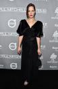 <p>The filmmaker worked a black wrap dress and silver sandals with a strong red lip. <i>[Photo: Getty]</i> </p>