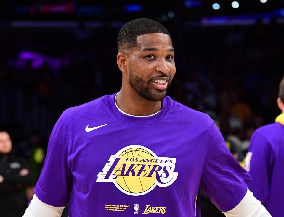 Tristan Thompson in a Lakers practice jersey, smiling during a basketball game warm-up