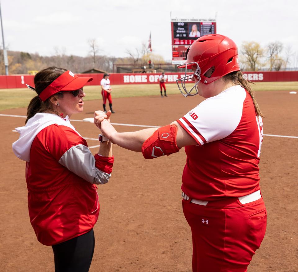 Wisconsin Badgers' head coach Yvette Healy talks with Kayla Konwent (12) during an NCAA softball game vs Nebraska Saturday April 23, 2022 in Madison, Wisconsin.Photo by Tom Lynn/Wisconsin Athletic Communications