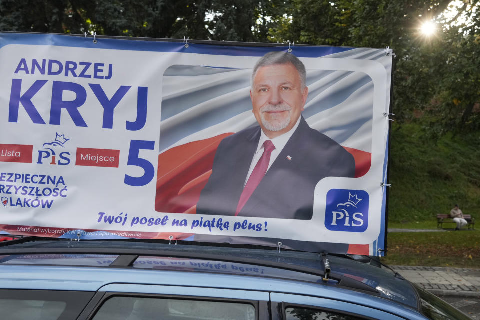Campaign poster of a ruling conservative PiS (Law and Justice party) candidate running Sunday in Poland's crucial parliamentary elections is displayed on car roof in Sandomierz, Poland, Friday, Oct. 13, 2023. At stake in the vote are the health of the nation's democracy, strained under the Law and Justice rule, and the foreign alliances of a country on NATO's eastern flank that has been a crucial ally. The main challenger is centrist Civic Coalition. (AP Photo/Czarek Sokolowski)
