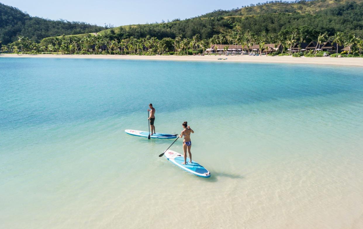 Two paddleboarders in Fiji