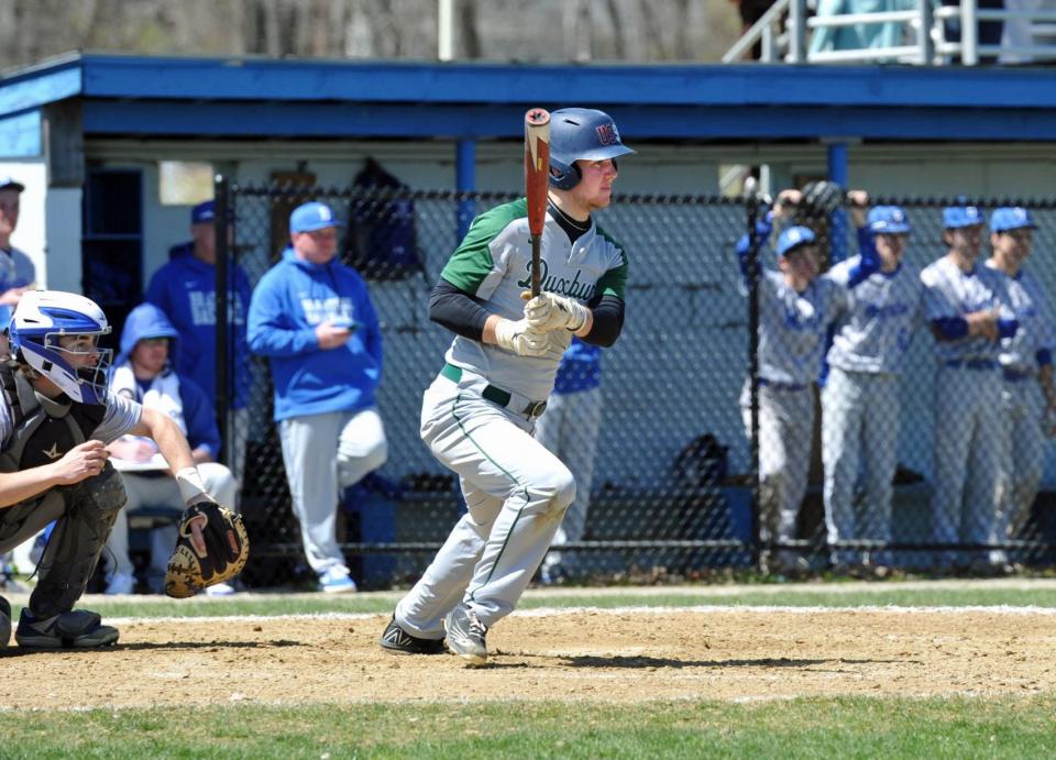 Duxbury's Teddy Massingham prepares to run to first after hitting a grounder during high school baseball action at Braintree High School, Monday, April 18, 2022.