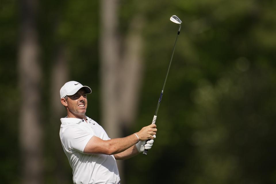 Rory McIlroy, of Northern Ireland, watches his tee shot on the 12th hole during the first round at the Masters golf tournament at Augusta National Golf Club Thursday, April 11, 2024, in Augusta, Ga. (AP Photo/George Walker IV)