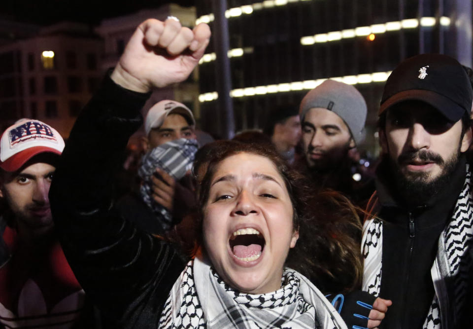 An anti-government protester shouts slogans, during ongoing protests against the ruling elite of corruption and financial crisis, in Beirut, Lebanon, Monday, Jan. 13, 2020. Lebanon is facing its worst economic crisis in decades, while protests against corruption and mismanagement have gripped the country since October. (AP Photo/Hussein Malla)