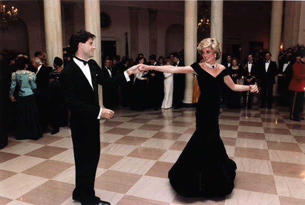 At the Reagan State Dinner for Prince Charles and Princess Diana: November 9, 1985, Diana wore a midnight blue velvet gown and danced with John Travolta. <br>