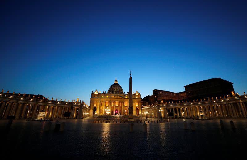 Pope Francis leads the Via Crucis (Way of the Cross) procession during Good Friday celebrations at the Vatican