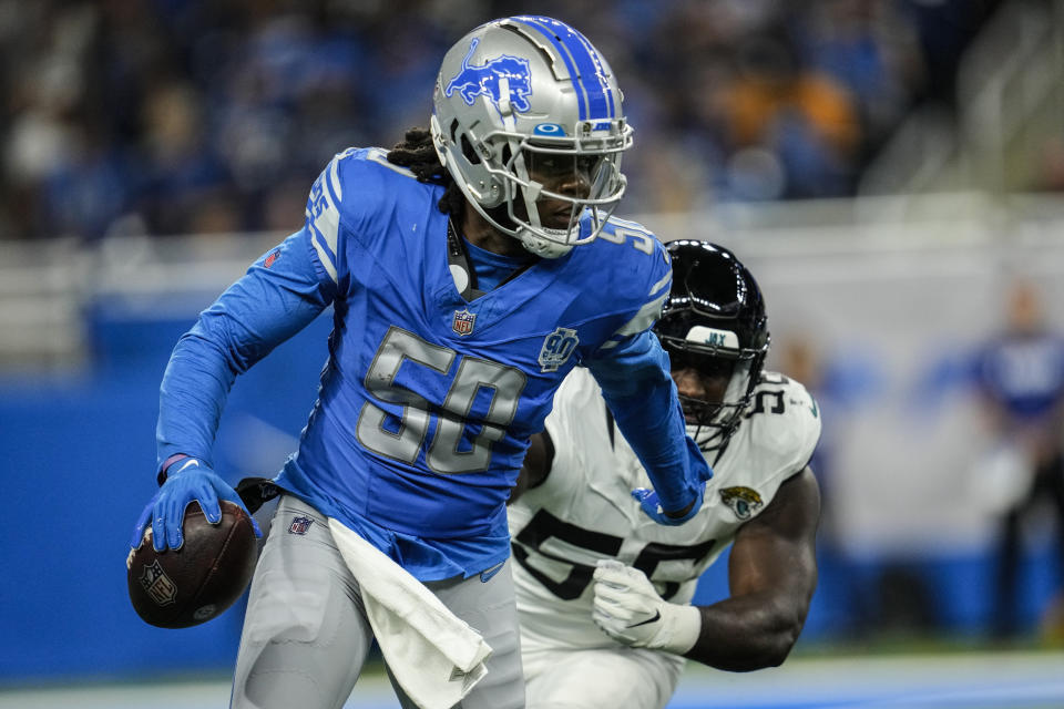 Detroit Lions quarterback Teddy Bridgewater (50) runs out of the pocket persued by Jacksonville Jaguars linebacker Yasir Abdullah (56) during the first half of a preseason NFL football game, Saturday, Aug. 19, 2023, in Detroit. (AP Photo/Paul Sancya)