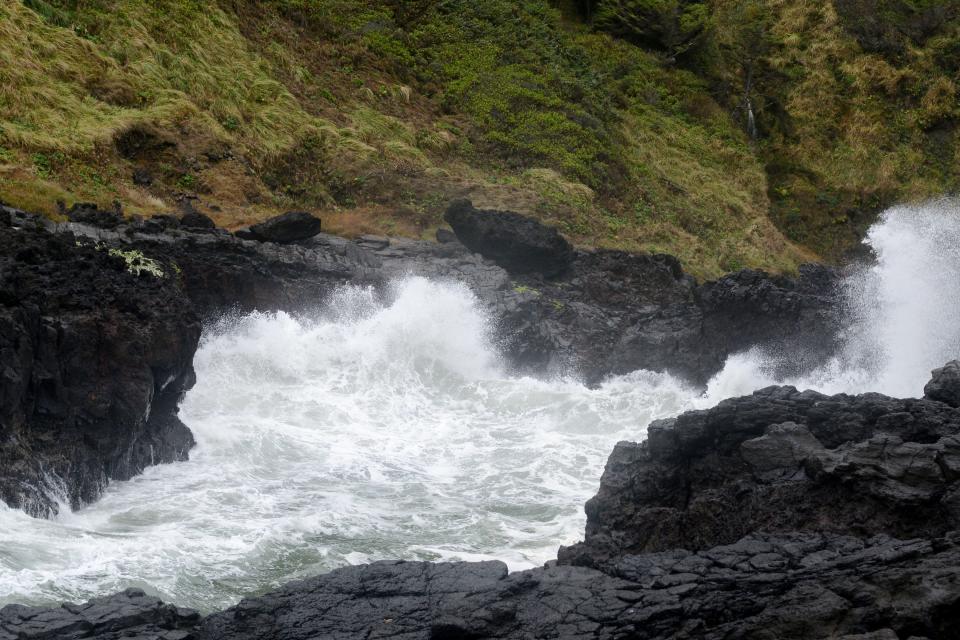 Waves crash along the rocks at Devil's Churn below Cape Perpetua near Yachats.