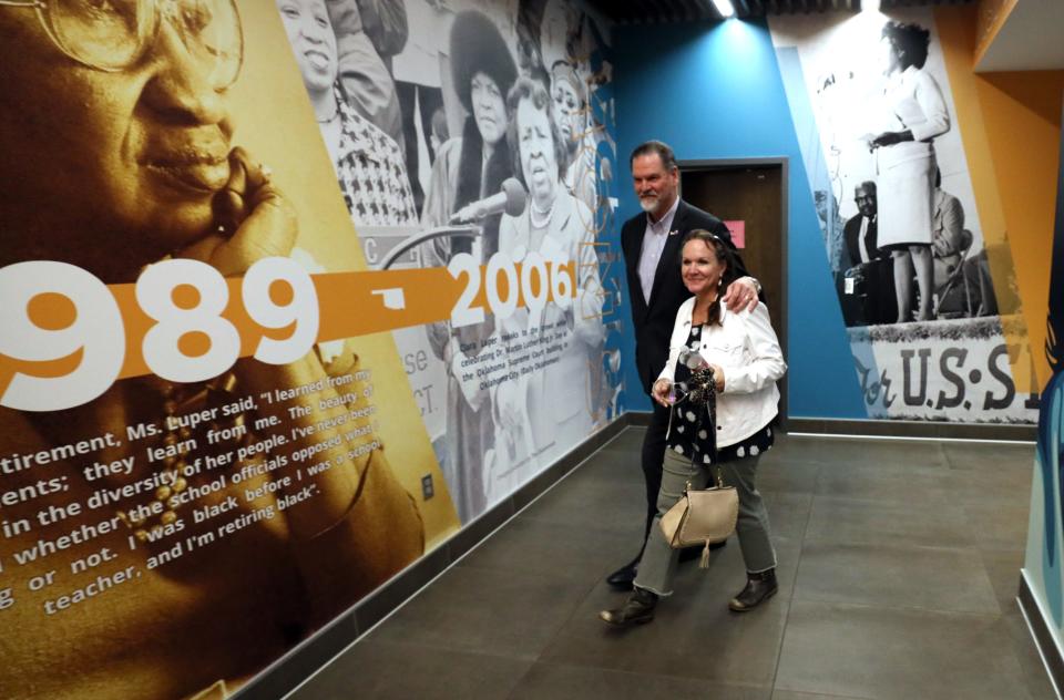 Oklahoma City Superintendent Sean McDaniel and wife, Traci, leave the Oklahoma City school board meeting Thursday when his resignation was accepted.