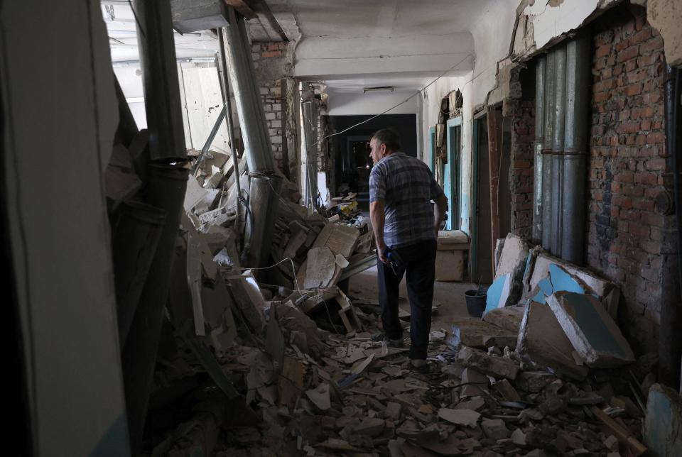 A local resident walks inside the destroyed city hospital of Hulyaypole, Zaporizhzhia Region (AFP via Getty Images)