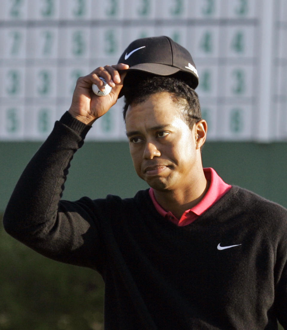 <p>Tiger Woods tips his cap on the 18th hole during the final round of the 2007 Masters golf tournament at the Augusta National Golf Club in Augusta, Ga., Sunday, April 8, 2007. (AP Photo/Elise Amendola) </p>